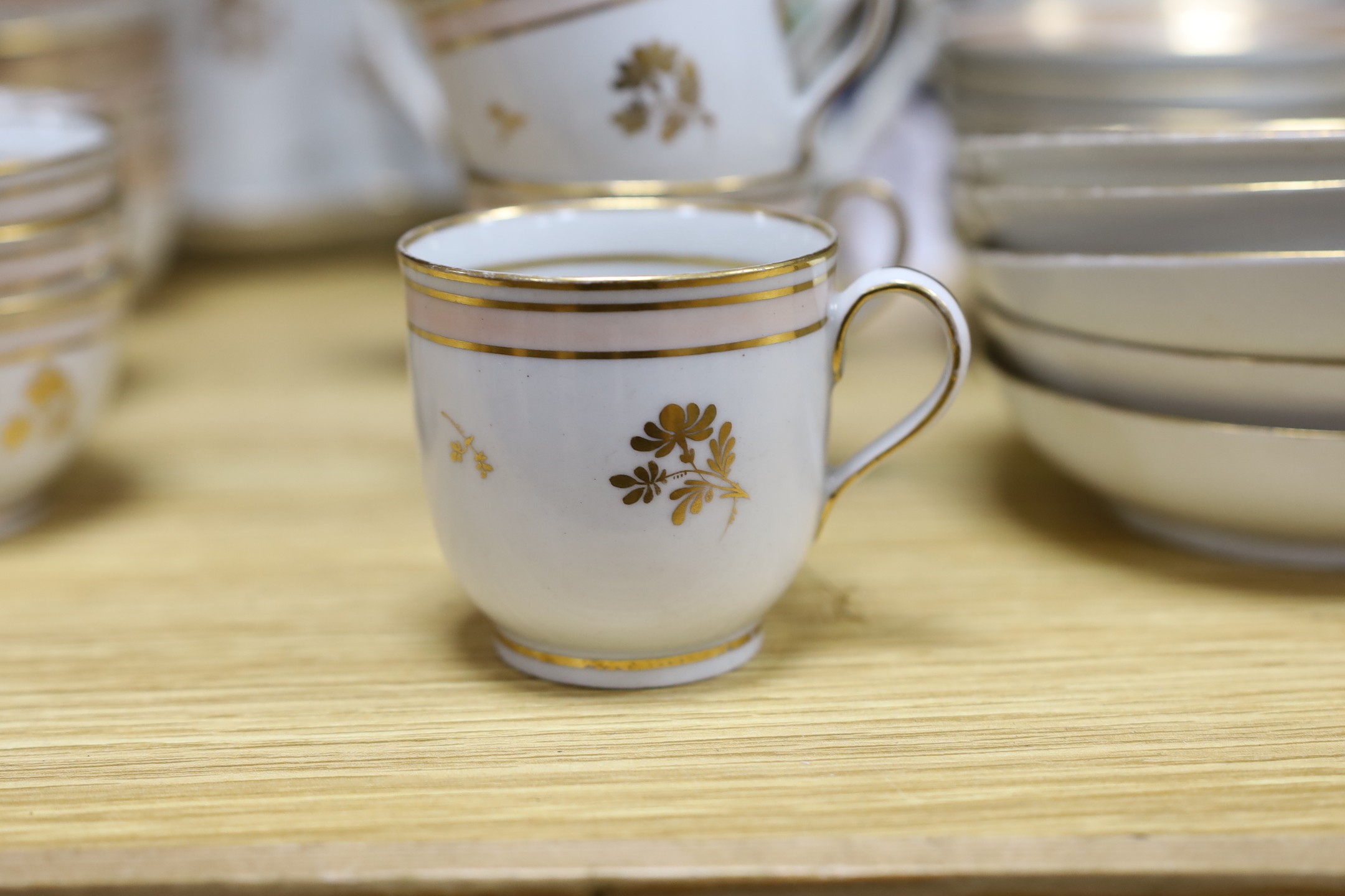 A 19th century Harvest jug and mug, a Victorian gilt tea set and mixed plates and a platter, jug 19 cms high.